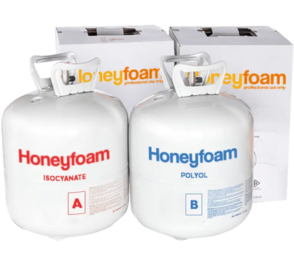 Two white cylindrical tanks with red and blue labeling, branded as Honeyfoam, with protective gear and a hose set displayed in the foreground.
